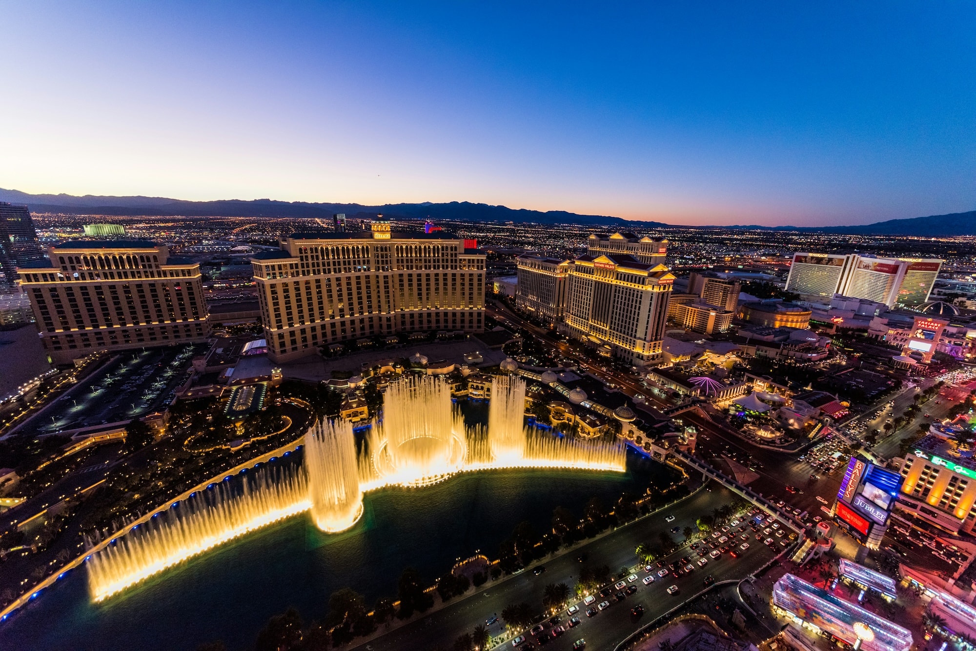 Aerial view of Las Vegas Strip with iconic fountains and hotels
